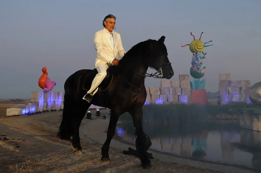 Andrea Bocelli performing on horseback at Teatro del Silenzio in Lajatico