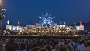 Orchestra and audience during a historic performance at Teatro del Silenzio